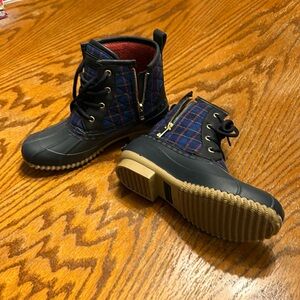 Never worn. Smoke free home. Blue plaid with fleece lining. Super cute.